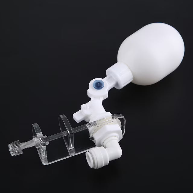 White medical device with a bulb on a black background