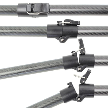 Close-up of several black quick-release clamp fittings attached to a dark carbon-fiber rod, arranged diagonally on a white background.