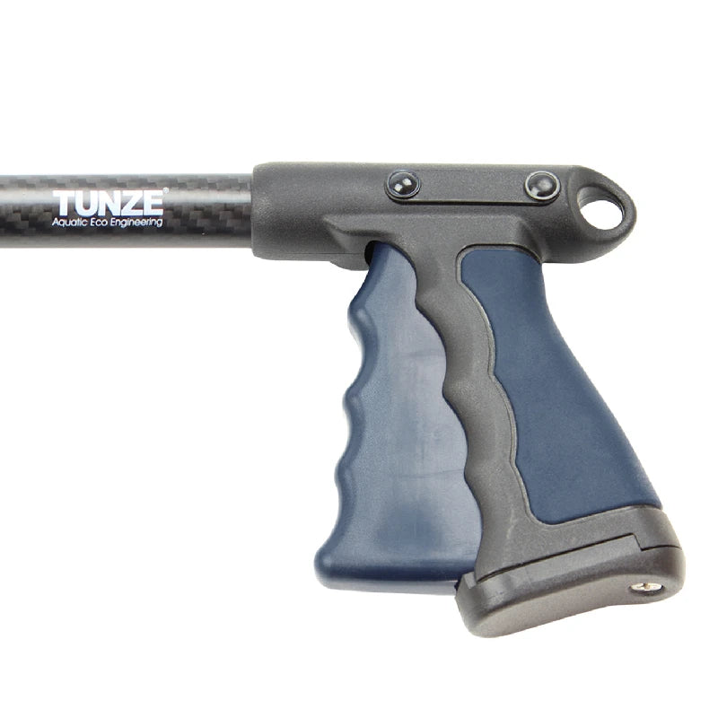 Close-up of a TUNZE carbon fiber pole with a dark gray and blue ergonomic handle grip, on a solid white background.